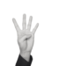 A black and white image of a white hand holding up four fingers