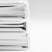 Black and white image of a few stacked folders and and books with lots of pages