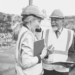 Two people wearing hard hats