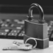 A close up of a padlock and key on a laptop