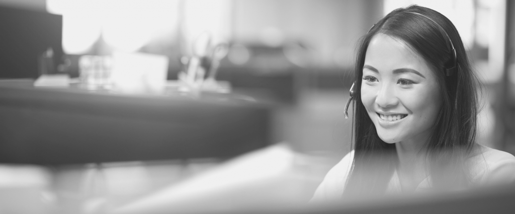 Contact us New Header A person with a headset