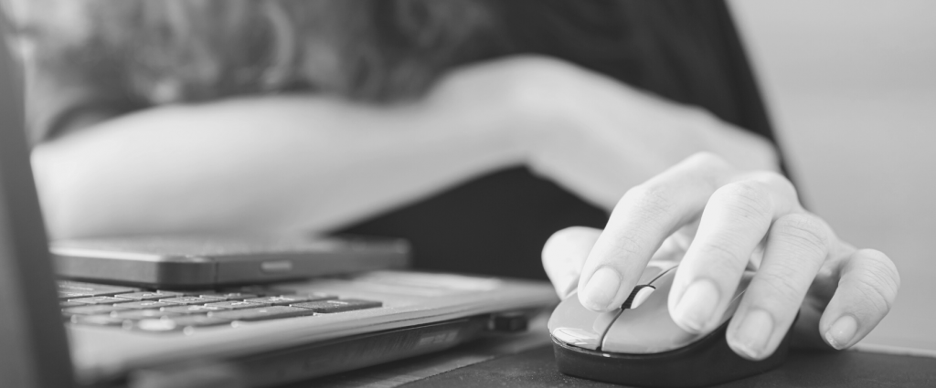 ISO 22301 Header B&W A close-up of a hand using a mouse