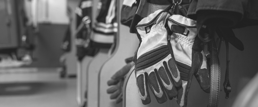 ISO 45001 Header B&W Gloves on a wall
