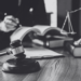 A gavel and scales on a table